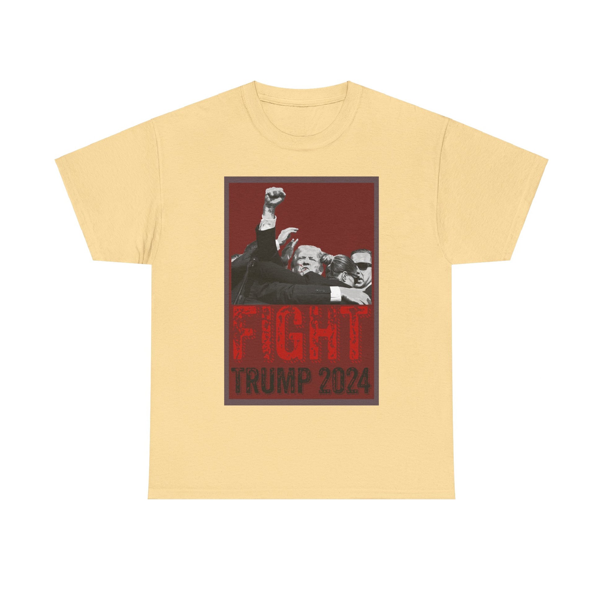 This image displays a yellow-haze colored, unisex, heavy cotton t-shirt with a graphic design on the front. The design features a black-and-white photograph of former President Donald Trump raising his fist, surrounded by his Secret Service, set against a red background. Below the photograph, the words “FIGHT” and “TRUMP 2024” are printed in bold letters, with “FIGHT” in a distressed red font and “TRUMP 2024” in black. The t-shirt is laid out on a plain white background, prominently showcasing the design.