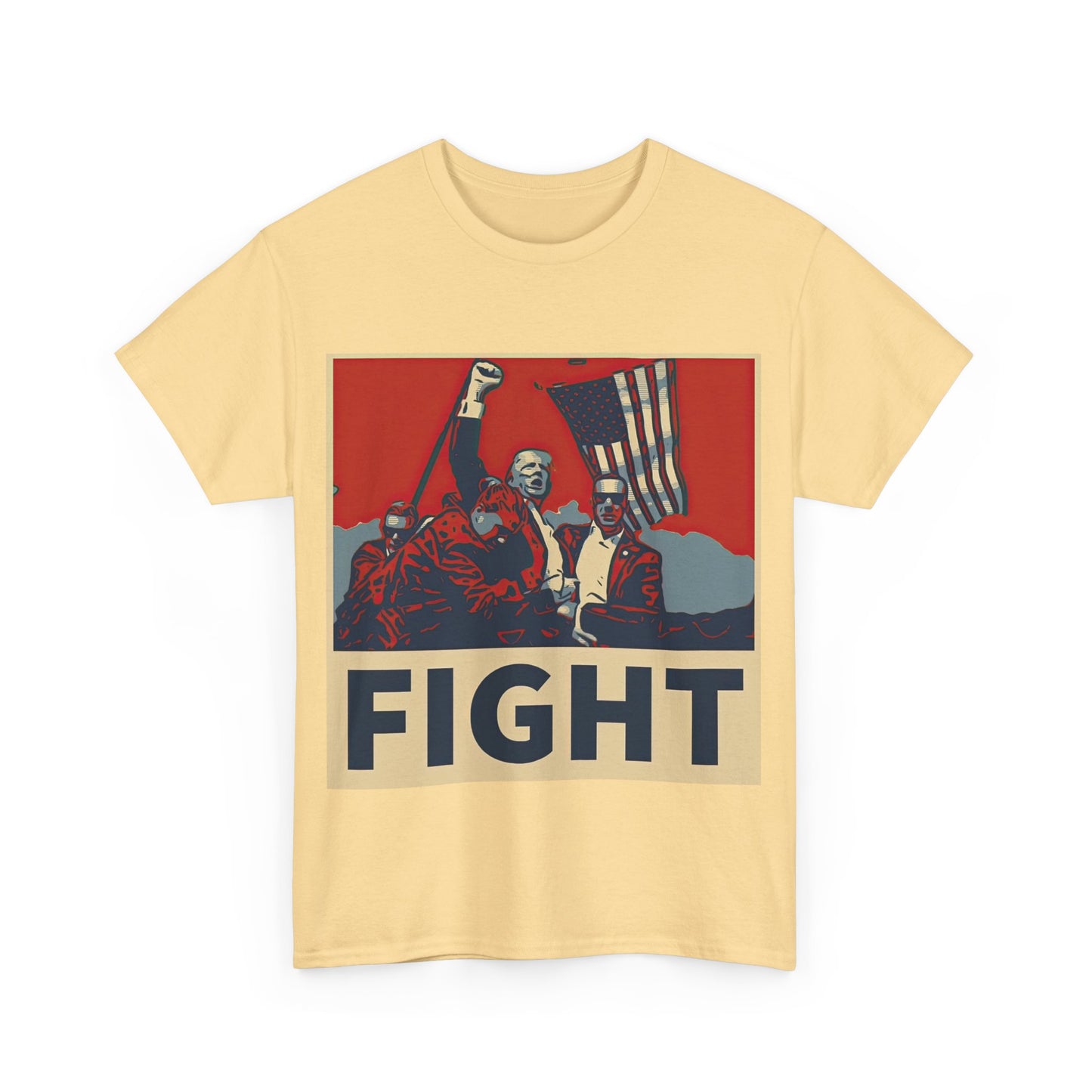 This image shows a yellow, unisex, heavy cotton t-shirt with a graphic design on the front. The design features a stylized, poster-like illustration of former President Donald Trump raising his fist and standing in front of an American flag. The word “FIGHT” is prominently displayed at the bottom of the illustration in bold capital letters. The graphic uses a color palette reminiscent of red, white, and blue, contributing to a patriotic theme. The t-shirt is displayed on a plain white background.