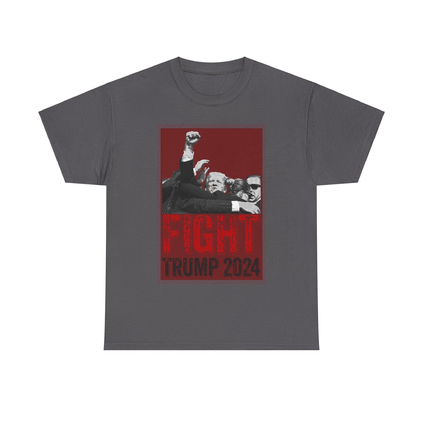 This image displays a charcoal-colored unisex heavy cotton t-shirt with a graphic design on the front. The design features a black-and-white photograph of former President Donald Trump raising his fist, surrounded by his Secret Service, set against a red background. Below the photograph, the words “FIGHT” and “TRUMP 2024” are printed in bold letters, with “FIGHT” in a distressed red font and “TRUMP 2024” in black. The t-shirt is laid out on a plain white background, prominently showcasing the design.