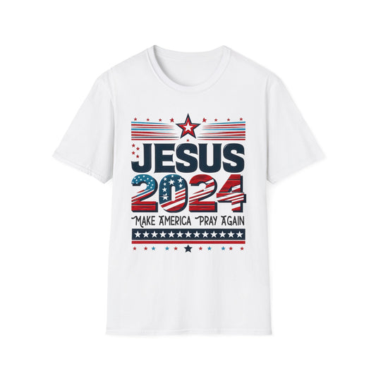 White t-shirt with a design that features ‘JESUS 2024’ in bold letters, styled with stars and stripes. Below it, the phrase ‘Make America Pray Again’ is displayed, surrounded by star accents.