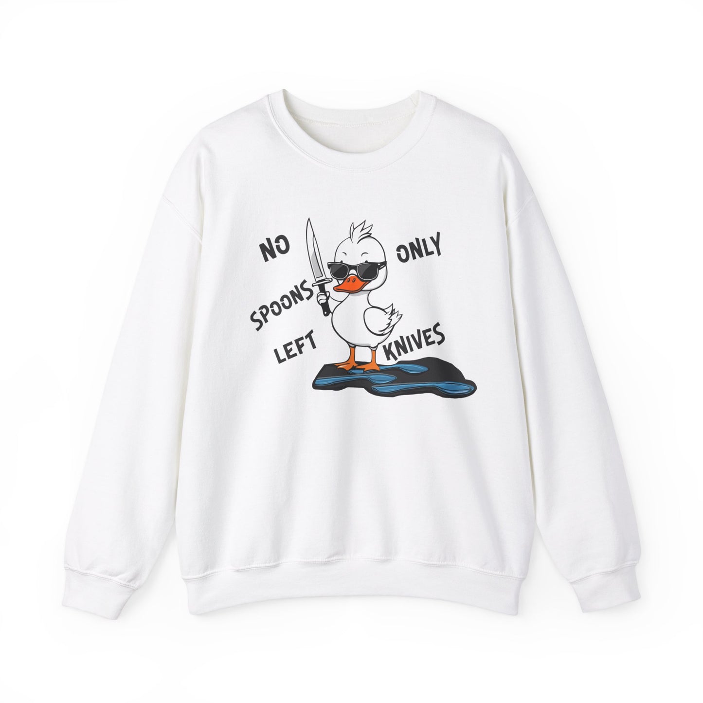 This image shows a white crewneck sweatshirt with a cartoon design of a duck holding a knife, standing in a puddle of spoons. The text around the duck reads “NO SPOONS LEFT, ONLY KNIVES.” The sweatshirt is displayed flat against a plain white background, clearly showcasing the humorous design and text.