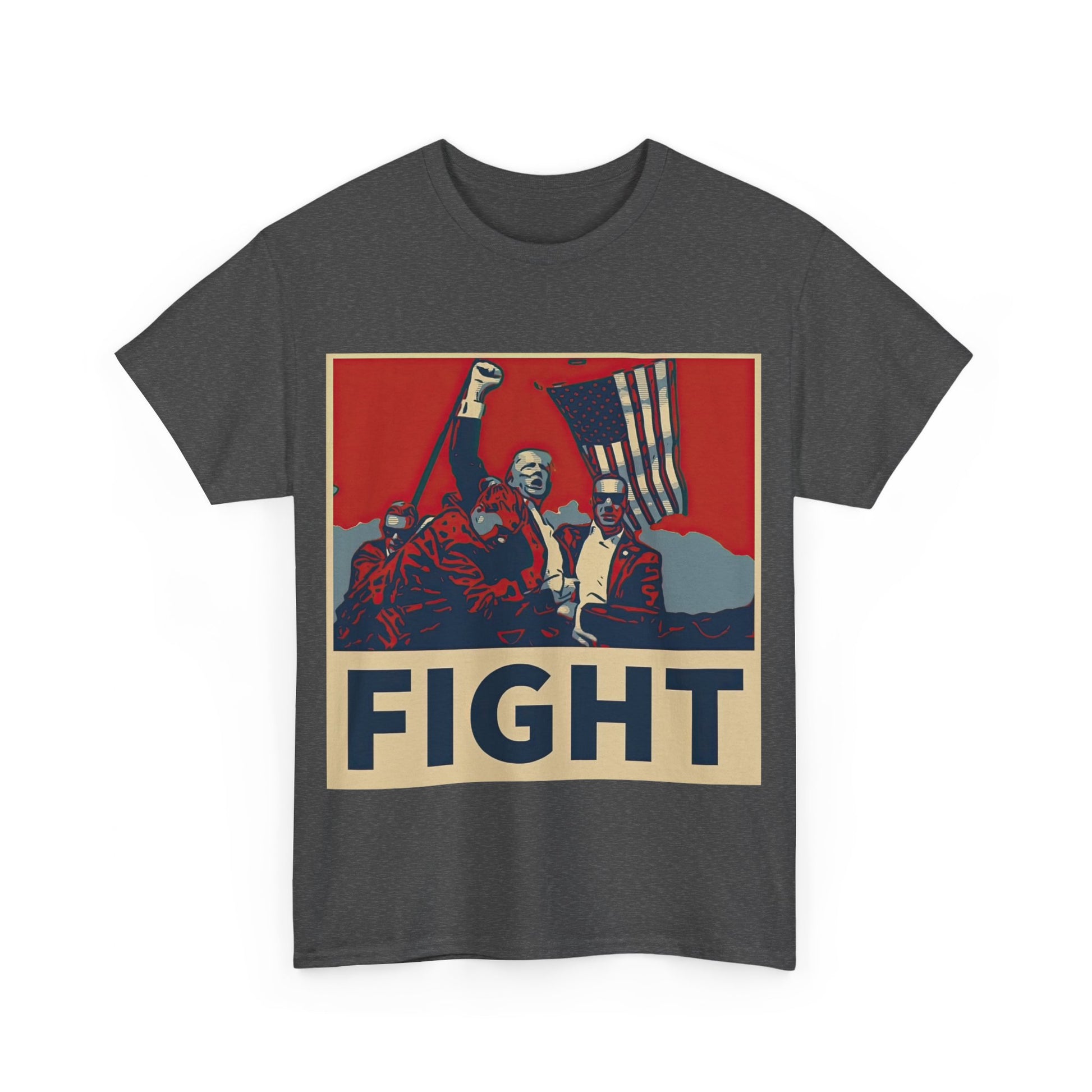 This image shows a dark grey colored unisex heavy cotton t-shirt with a graphic design on the front. The design features a stylized, poster-like illustration of former President Donald Trump raising his fist and standing in front of an American flag. The word “FIGHT” is prominently displayed at the bottom of the illustration in bold capital letters. The graphic uses a color palette reminiscent of red, white, and blue, contributing to a patriotic theme. The t-shirt is displayed on a plain white background.