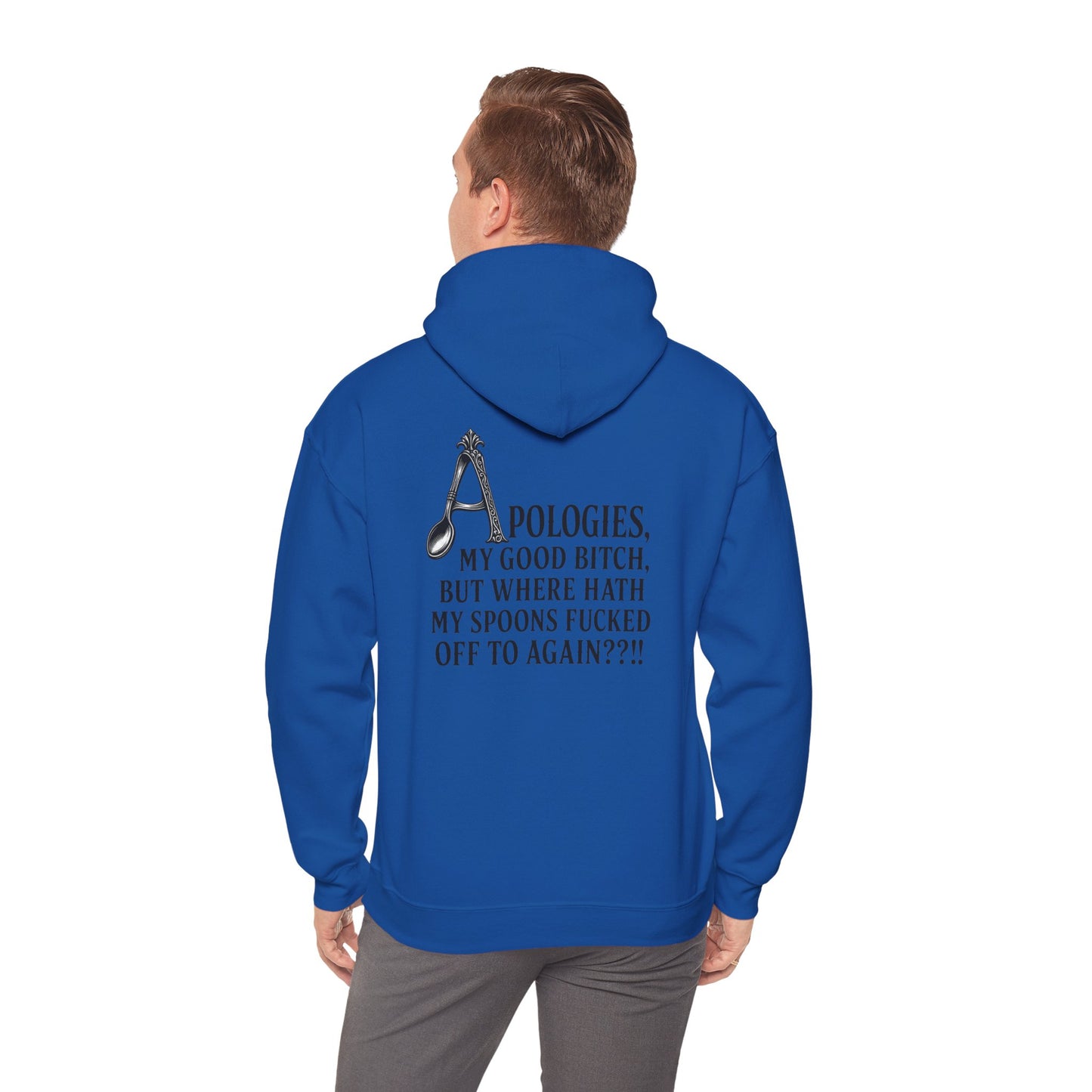 A man viewed from behind wearing a royal blue pullover hoodie with a black graphic and text on the back, paired with gray pants.