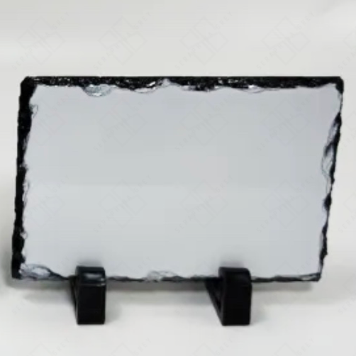 This image shows a custom photo slate with a blank white surface and a rectangular shape, featuring natural, uneven edges. The slate is mounted on two small black stands, providing a stable base for display. The photo slate is set against a plain white background, highlighting its textured edges and smooth surface, ready for customization. The watermark with “Seraphina Grey” is subtly visible in the background.