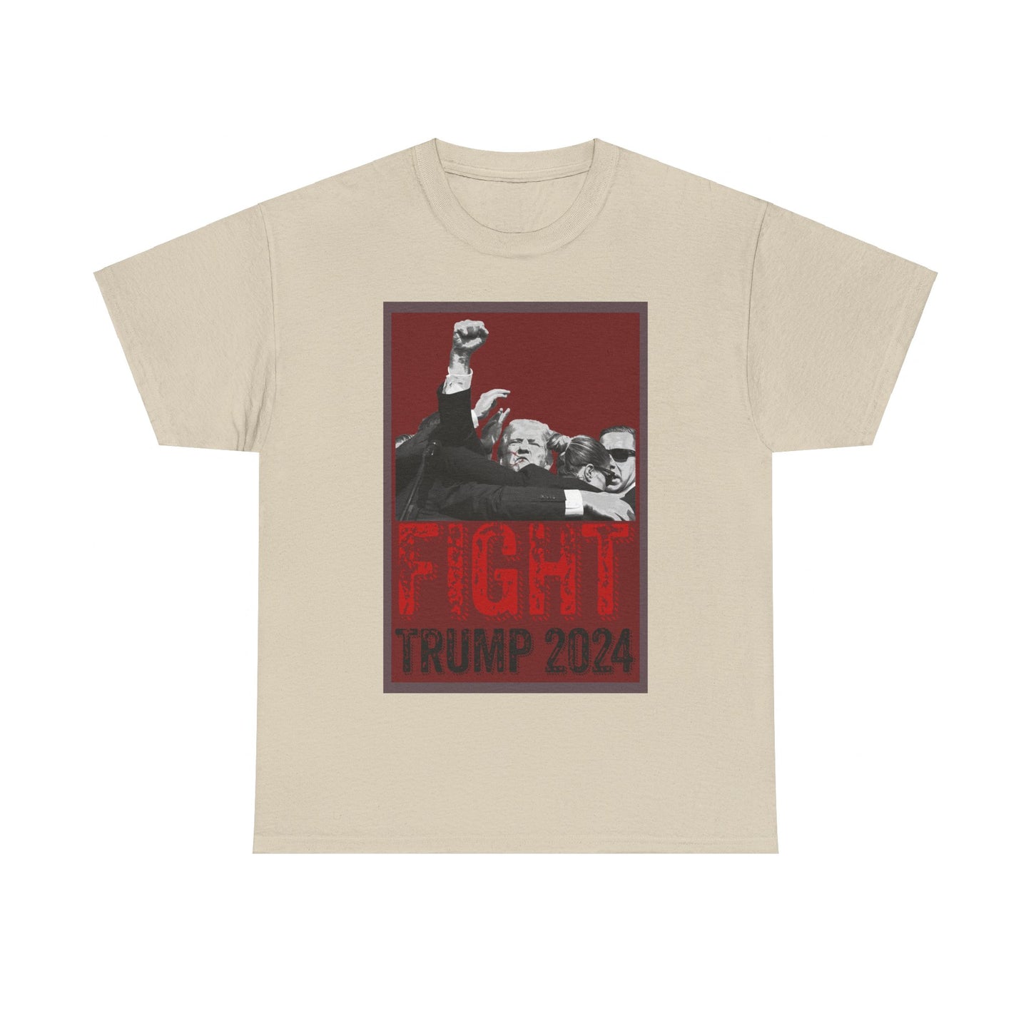 This image displays a sand-colored, unisex, heavy cotton t-shirt with a graphic design on the front. The design features a black-and-white photograph of former President Donald Trump raising his fist, surrounded by his Secret Service, set against a red background. Below the photograph, the words “FIGHT” and “TRUMP 2024” are printed in bold letters, with “FIGHT” in a distressed red font and “TRUMP 2024” in black. The t-shirt is laid out on a plain white background, prominently showcasing the design.