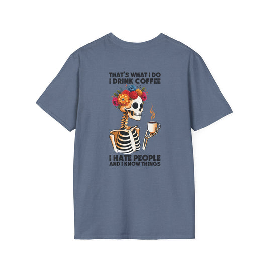 Heather Indigo t-shirt with a skeleton design and text on the back: "That's what I do." I drink coffee, I hate people, and I know things. On a white background
