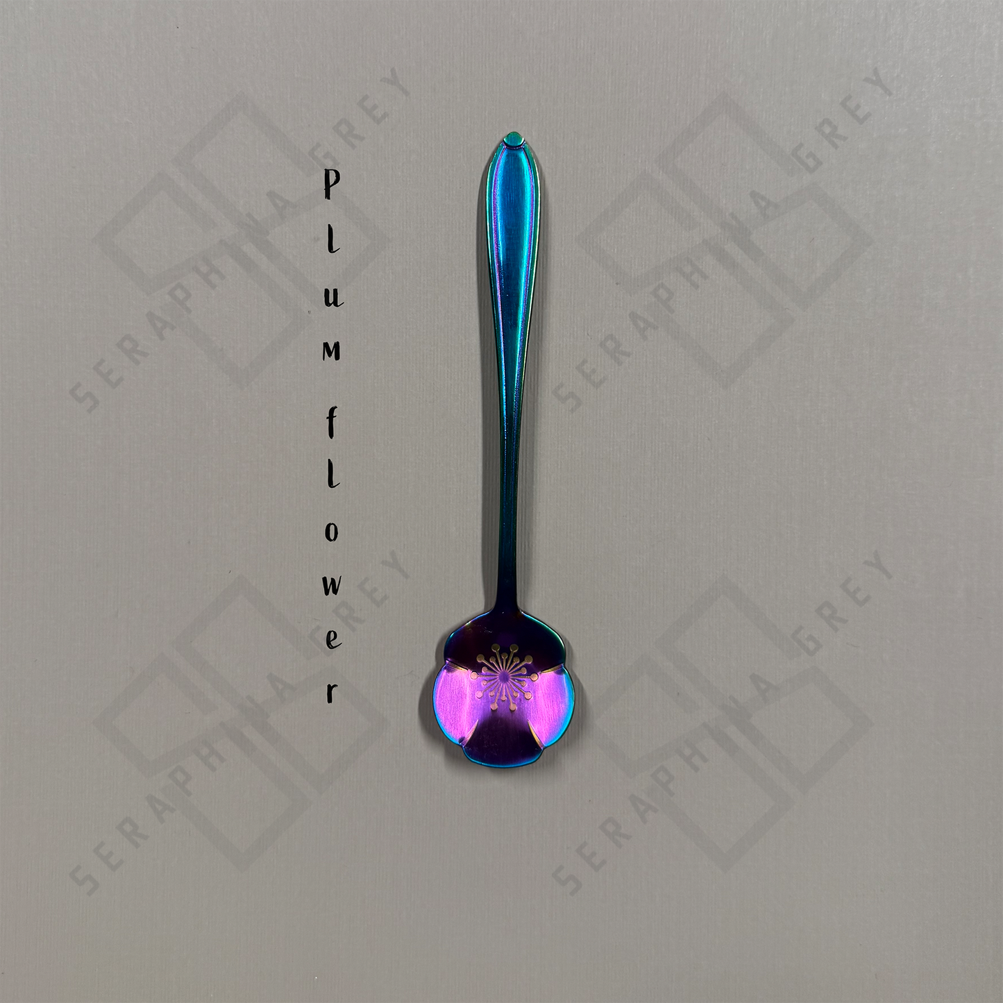 Rainbow Spoon with plum flower floral design on a branded background