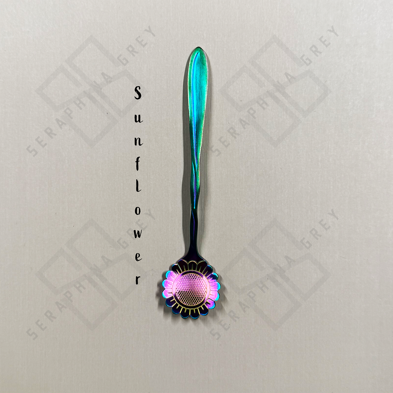 Rainbow Spoon with sunflower floral design on a branded background