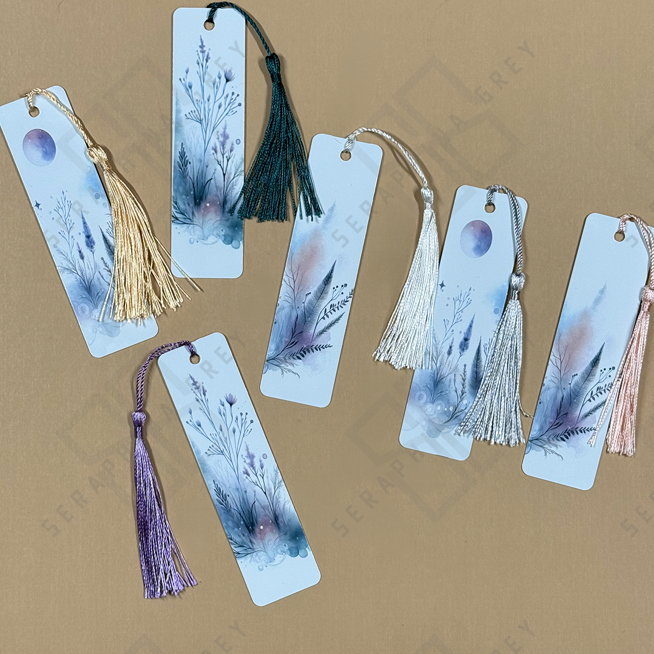 Set of bookmarks with tassels on a beige background