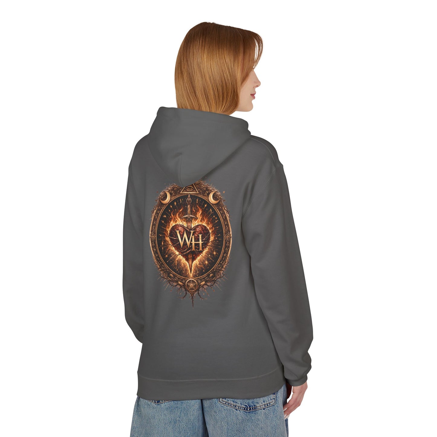 Model wearing a charcoal-colored pullover hoodie shown from the back, featuring the large circular “Wild Heart” mystical crest with a flaming heart, sword, crescent moons, stars, and “WH” monogram in warm brown and orange tones.