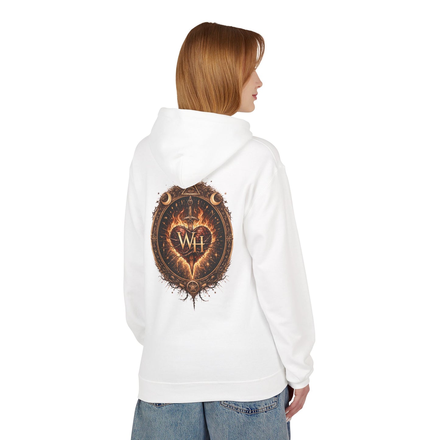 Model wearing a white pullover hoodie shown from the back, featuring the large circular “Wild Heart” mystical crest with a flaming heart, sword, crescent moons, stars, and “WH” monogram in warm brown and orange tones.