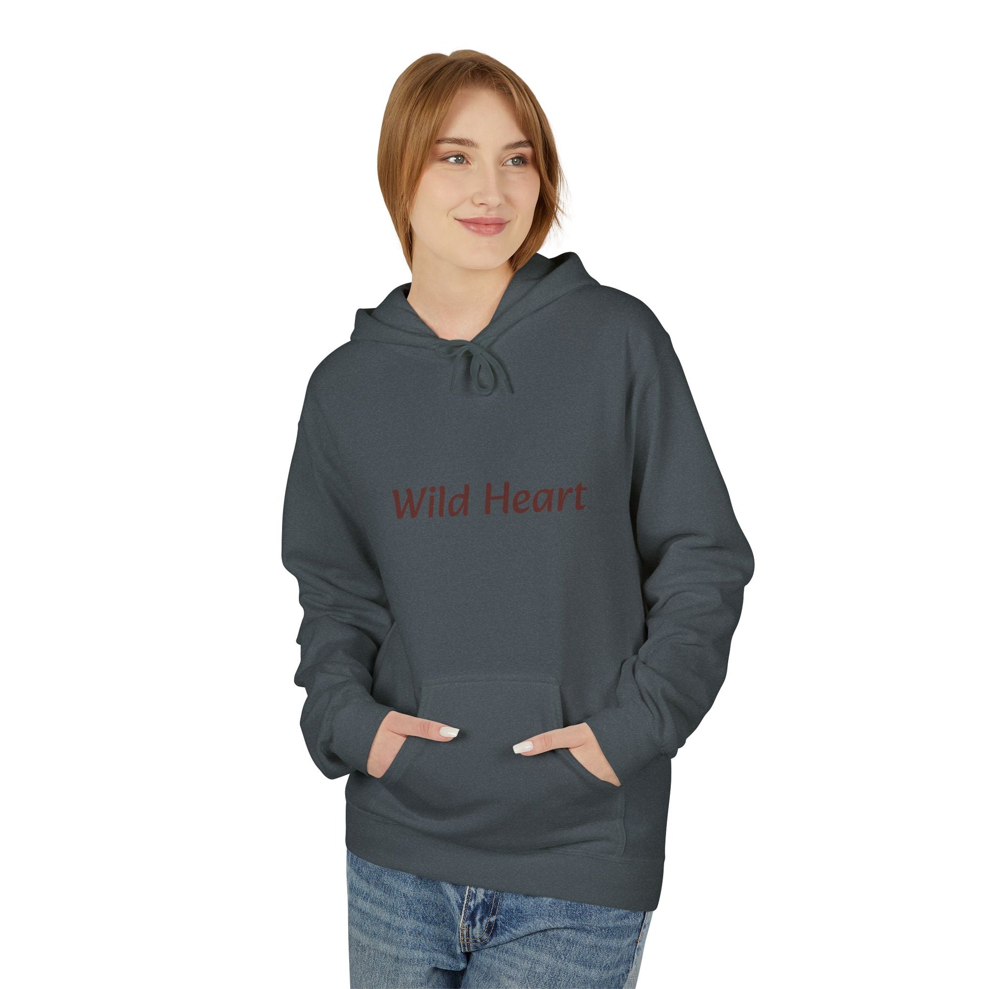 Model wearing a dark heather-colored pullover hoodie with burgundy “Wild Heart” text across the chest, drawstring hood, and front kangaroo pocket, shown against a white background.