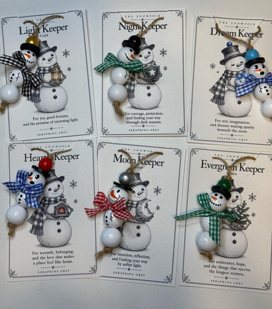 All six handmade Snowfolk bead ornaments with their illustrated Keeper lore cards