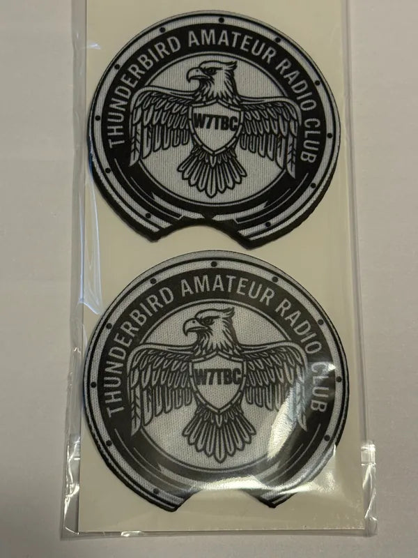 Two round Thunderbird Amateur Radio Club logo pieces