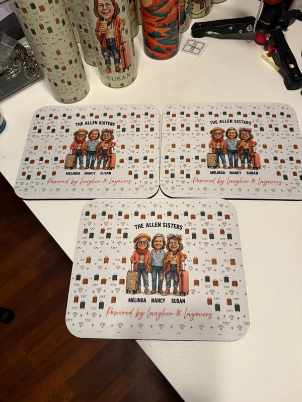 Three finished sisters mousepads with illustrated tumblers behind them