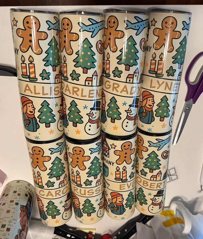 Personalized tumblers with gingerbread people, airplanes and Christmas trees